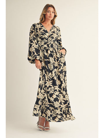 Woman wearing a floral dress on a plain background